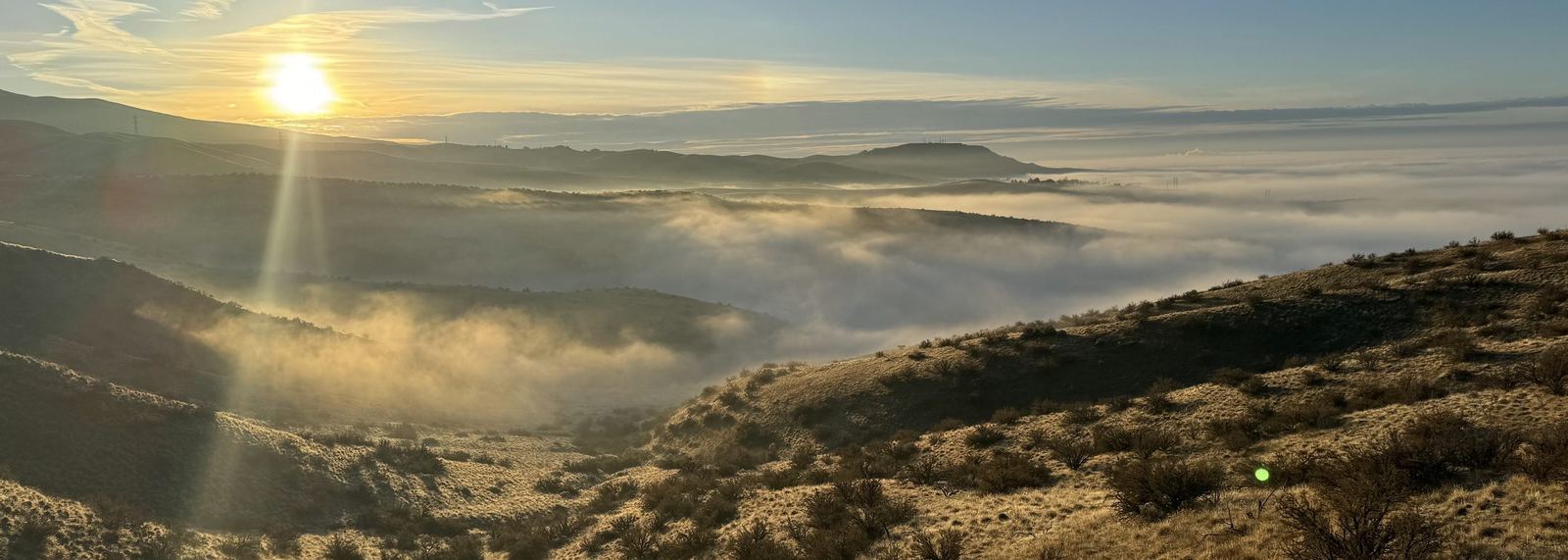Sunset above the clouds over the Idaho foothills